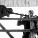 Trying to squeeze my guitar into my cheek...almost!