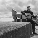 Wistful busking on the pier. Cove Bay 2020